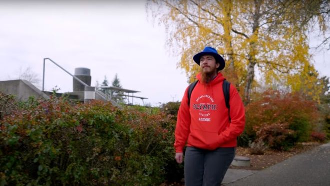 Students in red OC sweatshirt walking outdoors