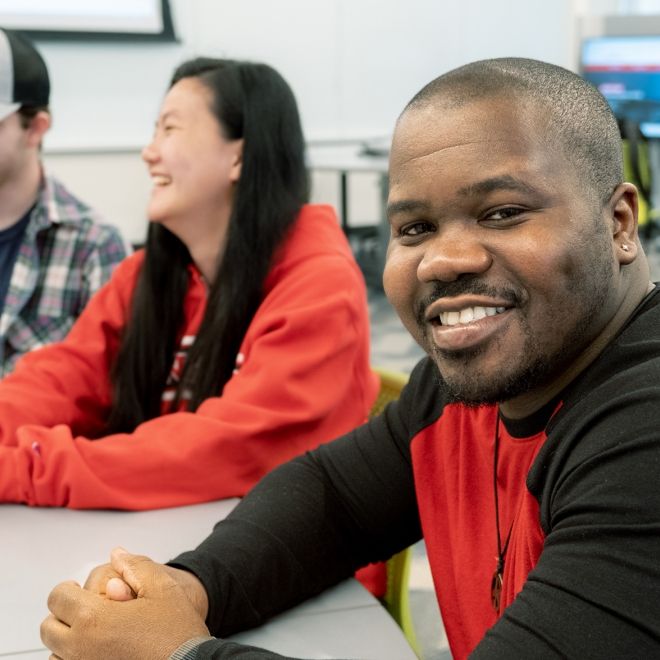 Diverse students at table.