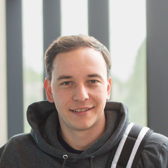 Male student with backpack.