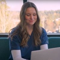 Female student working on laptop.
