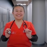 Nursing student posing with stethoscope in Bldg. 7