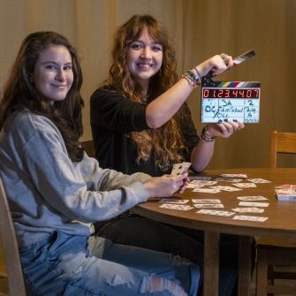 Film students smiling on set