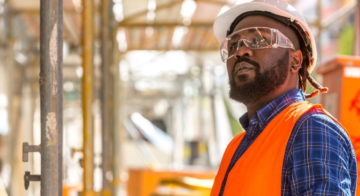 Male in hardhat and safety glasses