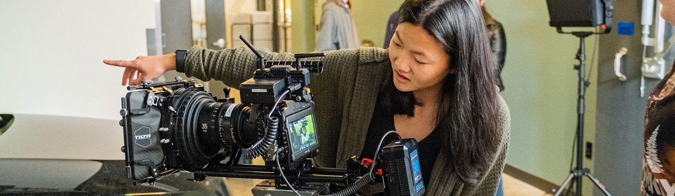 Film school student using camera.