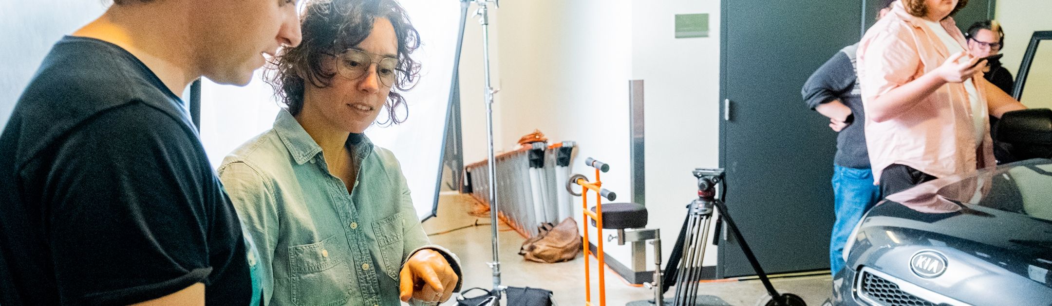 Amy Hesketh with student on set at OC.