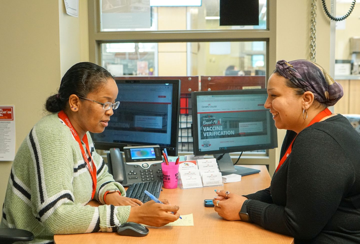 Student workers at a computer.