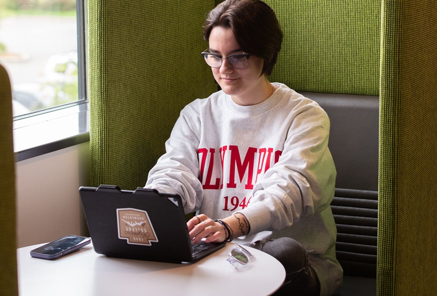 Student working on campus on a tablet