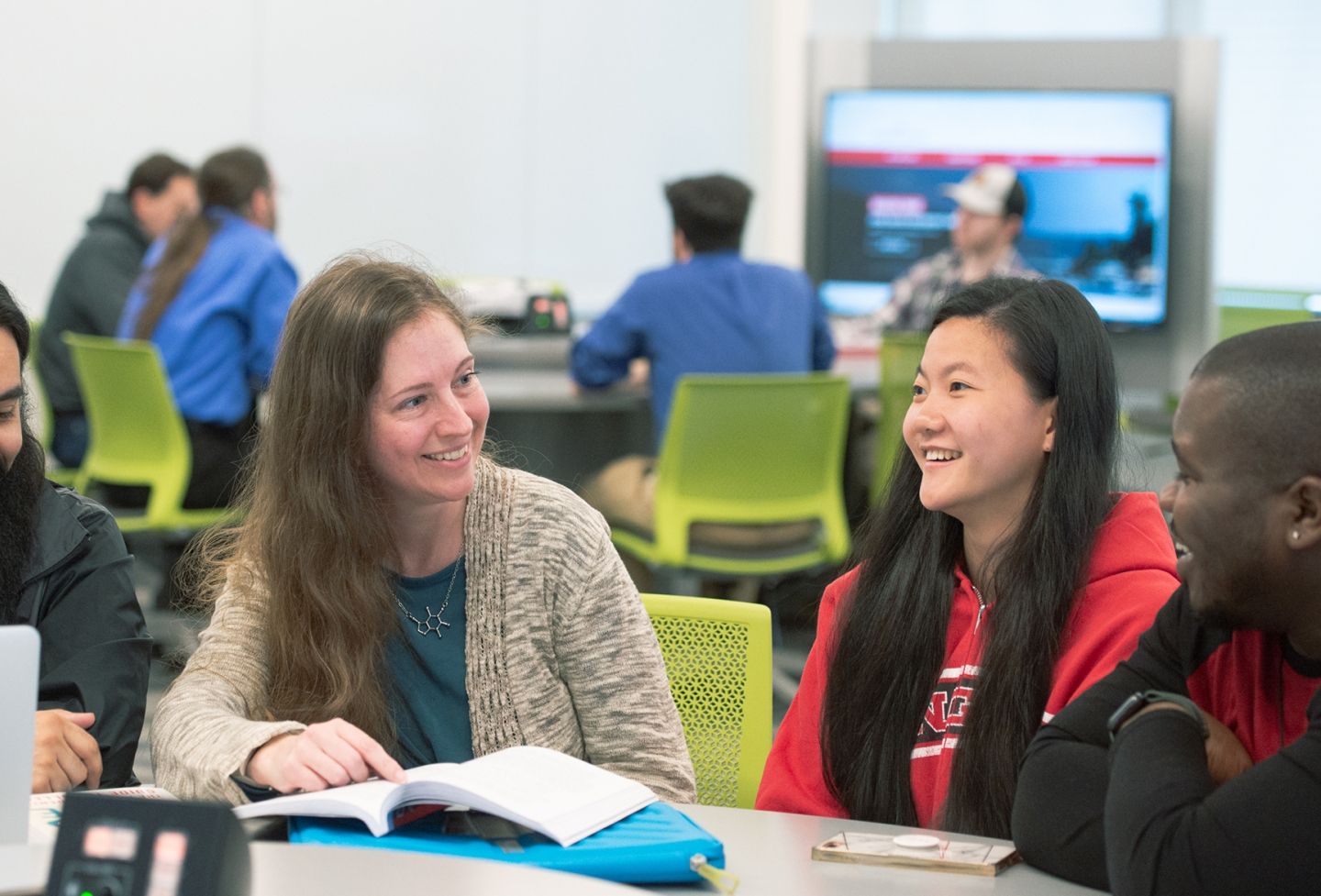Student with teacher in classroom.